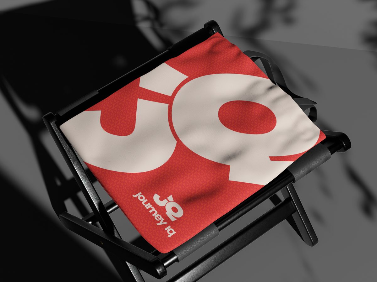 JourneyIQ coral fabric with the JQ mark